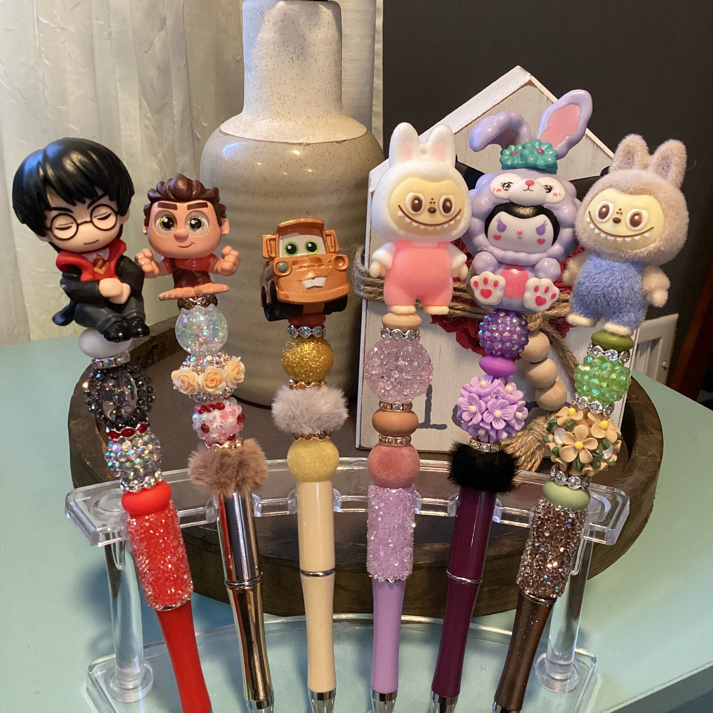 beaded doorables/ figures pens