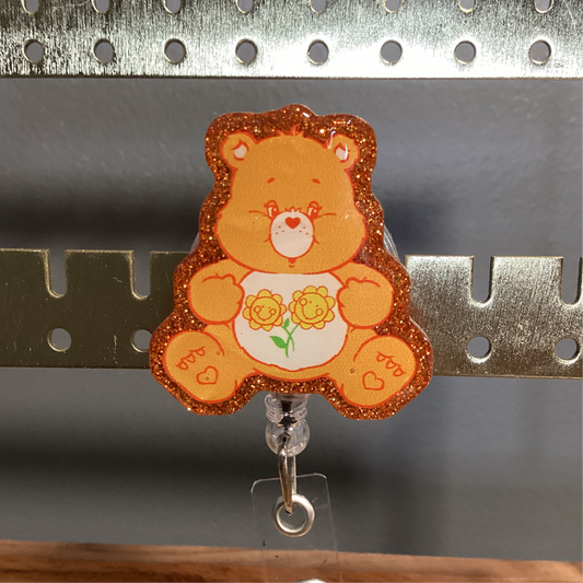 Orange Care Bear Badge Reel